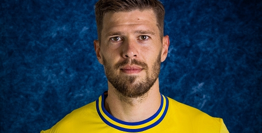 Michał Marcjanik na podium występów w Arce Gdynia